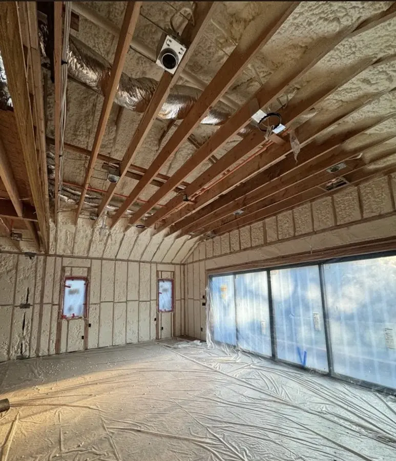 Interior walls and ceiling insulated with spray foam during new construction in Moore